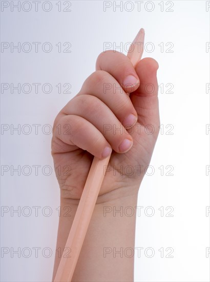 Hand holding a color pencil on a white background