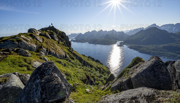 Hikers at the top of Dronningsvarden or Stortinden