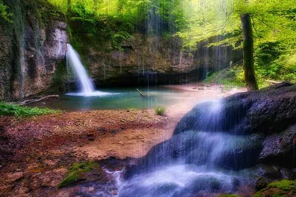 Waterfall in the forest with small pond near Kilchberg