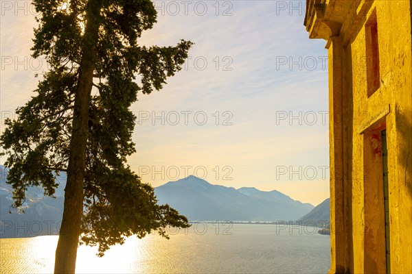 Church with Cypress Tree and Lake Lugano with Mountain and Blue Sky in Park San Michele in Castagnola in Lugano