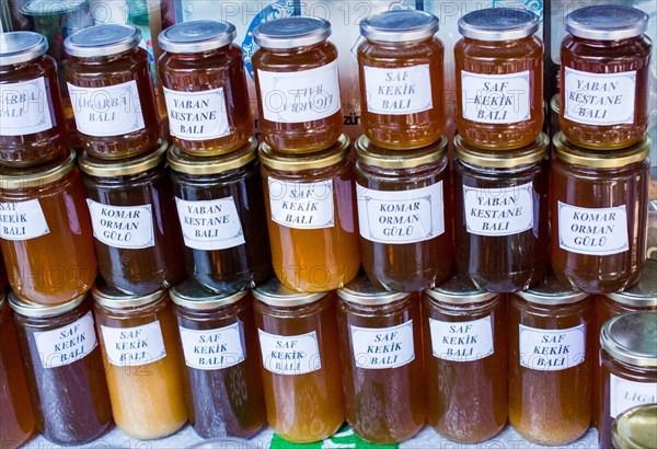 Glass jar of full of fresh honey with lid