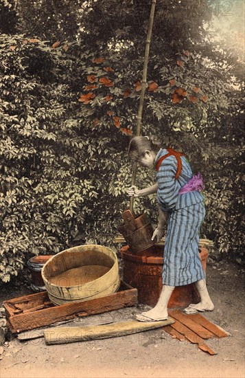 Peasant girl drawing water at the well