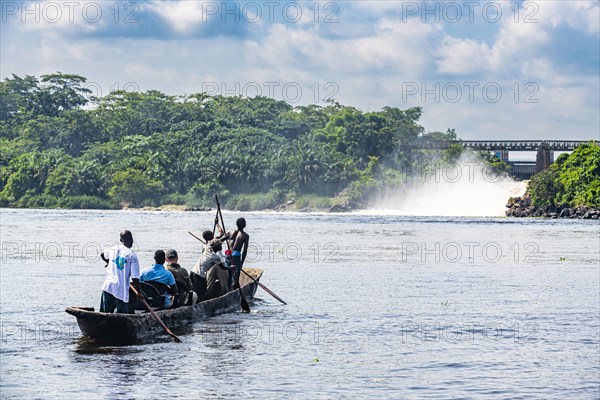 Fishermen fishing below the rapids on the Tshopo river