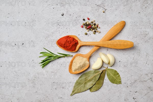 Top view of spice and herbs for cooking on concrete background