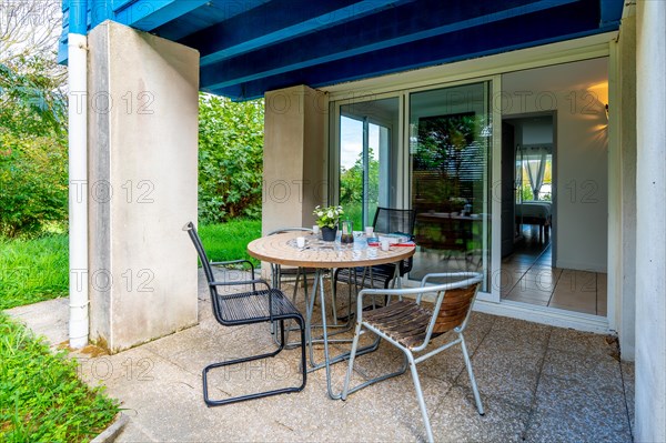 Summer house terrace. Backyard of the house next to the garden