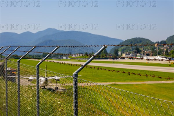 Lugano Airport Runway with Mountain Viewand Clear Sky in a Sunny Day in Ticino
