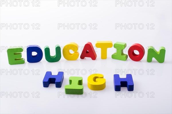 The word HIGH EDUCATION written with colorful letter blocks