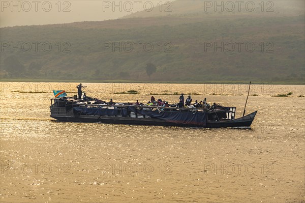 Overloaded riverboat on the Congo river