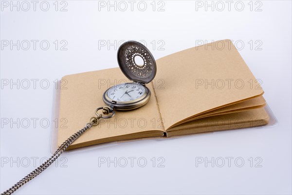 Retro style pocket watch on white background