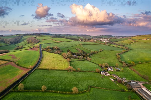 Sunset over fields and farms from a drone