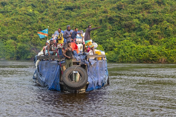 Overloaded riverboat on the Congo river