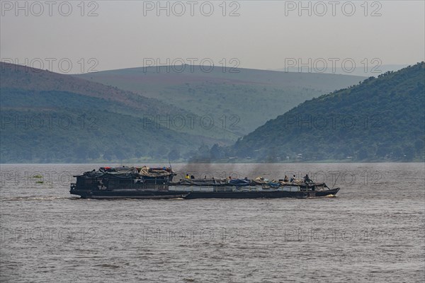 Overloaded riverboat on the Congo river