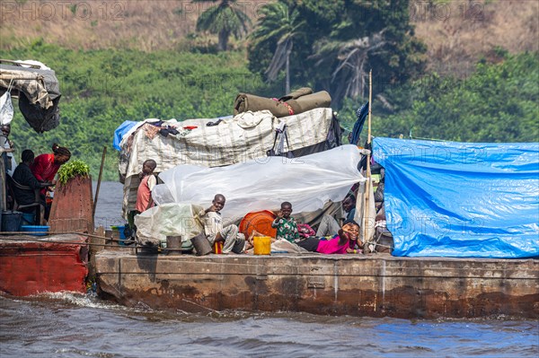 Overloaded riverboat on the Congo river