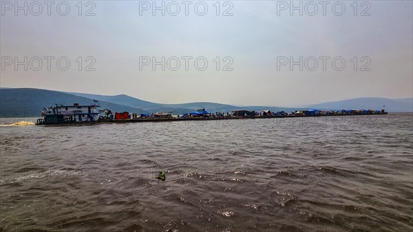 Overloaded riverboat on the Congo river