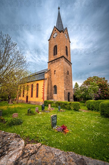 View of the Protestant village church of St. Martin with the associated cemetery in Kunitz