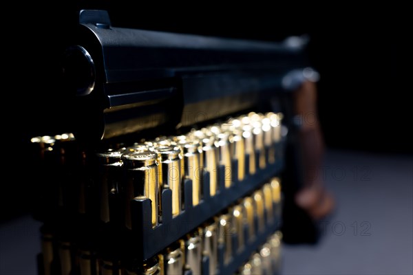 Elegant Semiautomatic 9mm Handgun Leaning on Bullet Ammunition in Switzerland