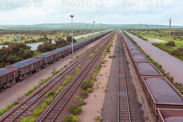 Goods trains loaded with iron ore at the entrance to the ore loading port