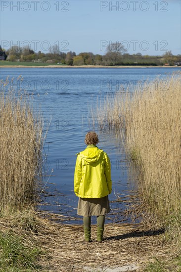 Woman standing on the bank of the Schlei