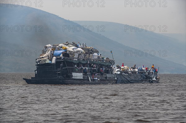 Overloaded riverboat on the Congo river