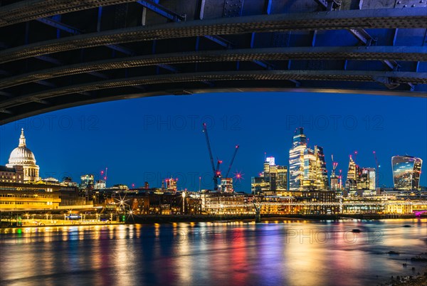 View of St. Pauls Cathedral and Skyscrapers from under Blackfriars Bridge