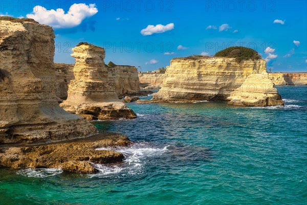 Rock stacks and crystal clear sea of the Faraglioni di Sant Andrea