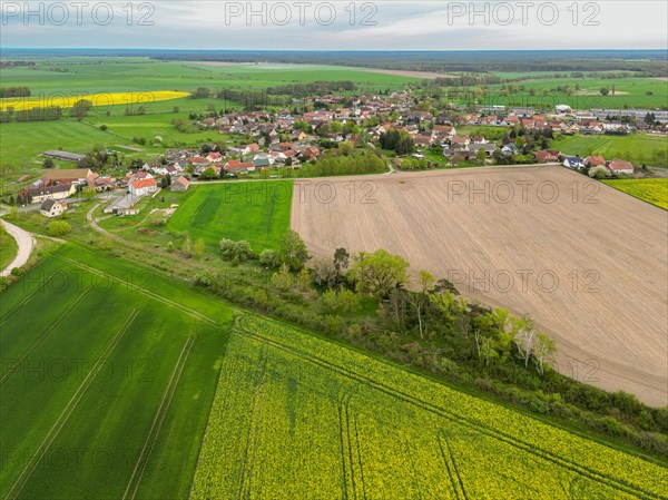 Village with agricultural land around it