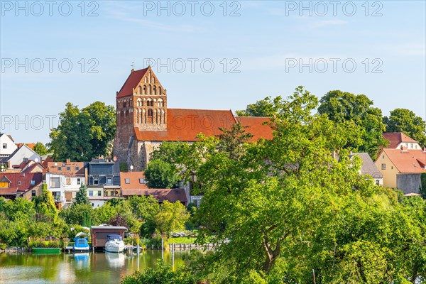 View over the town lake of Lychen to the town church of St. John