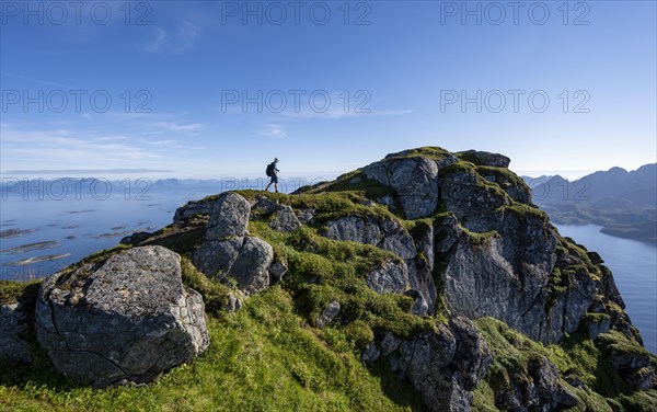 Hikers at the top of Dronningsvarden or Stortinden