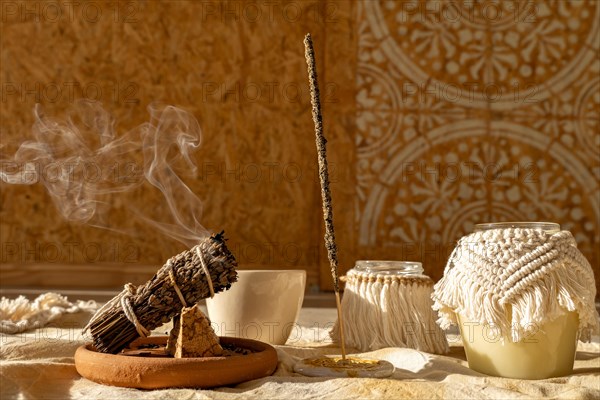 Incense and candles with mandala background