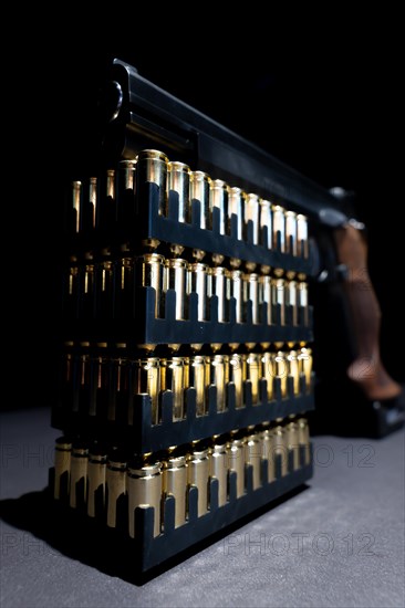 Elegant Semiautomatic 9mm Handgun Leaning on Bullet Ammunition in Switzerland