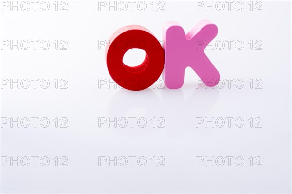 The word OK written with colorful letter blocks