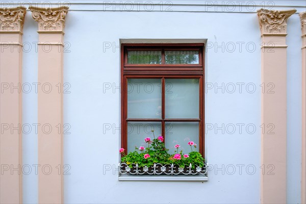 Window of a noble architecture decorated with flowers in the villa district of Sassnitz