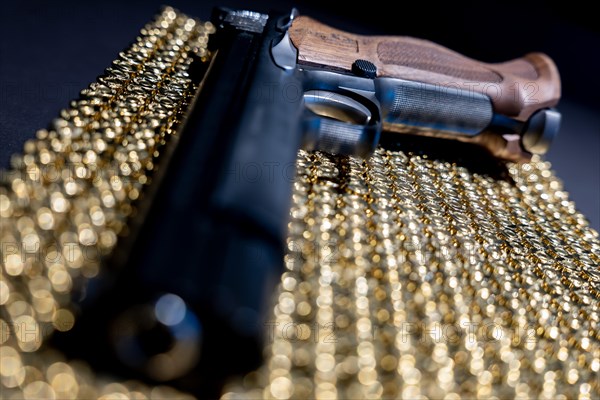 Elegant Semiautomatic 9mm Handgun with Swiss Helvetia Symbol Leaning on Bullet Ammunition in Switzerland