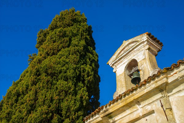 Church with Bell and a tree with Clear Blue Sky in Park San Michele in Castagnola in Lugano