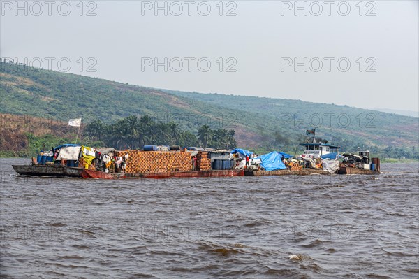 Overloaded riverboat on the Congo river