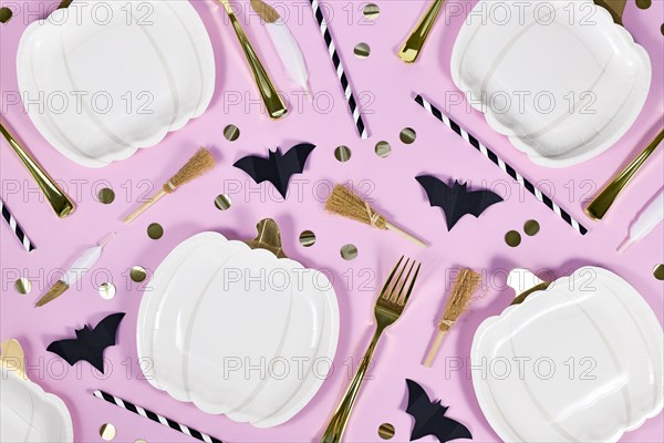 Halloween party flat lay with pumpkin shaped paper plates