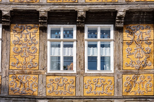 Frames with painted ornaments on one of the half-timbered houses typical of the World Heritage town on the Schlossberg