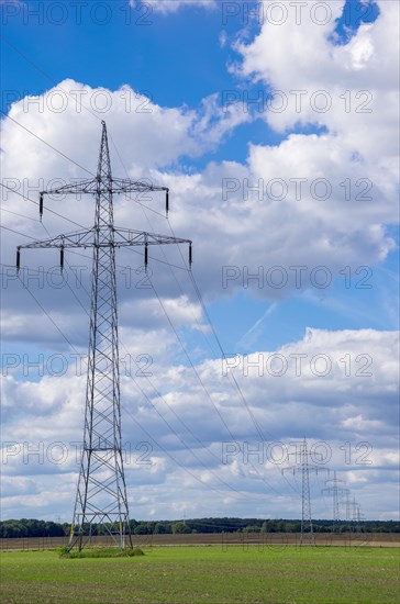 Distribution of electrical energy by means of overland power line consisting of overhead line pylons and overhead line