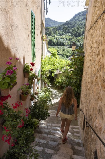 Tourist walking through alley