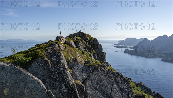 Hikers at the top of Dronningsvarden or Stortinden