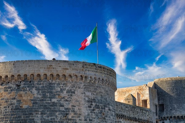 Italian flag on the Castelo in the fishing port of Gallipoli