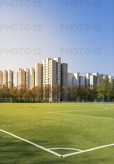 Football field and high-rise buildings in the Maerkisches Viertel residential area in Berlin Reinickendorf