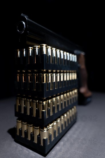 Elegant Semiautomatic 9mm Handgun Leaning on Bullet Ammunition in Switzerland