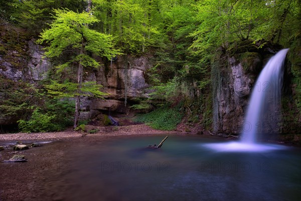 Waterfall in the forest with small pond near Kilchberg