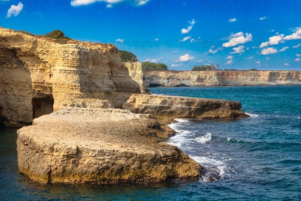 Rock stacks and crystal clear sea of the Faraglioni di Sant Andrea