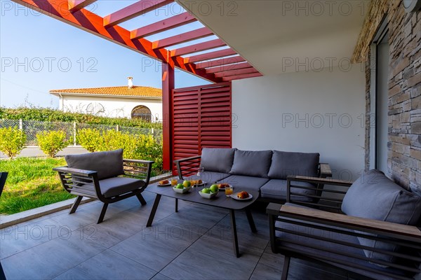 Summer house terrace. Beautiful terrace with breakfast prepared at dawn next to the garden