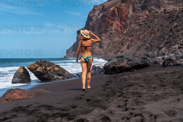 Enjoying the holidays on the black volcanic sand beach of El Ingles in Valle Gran Rey on La Gomera