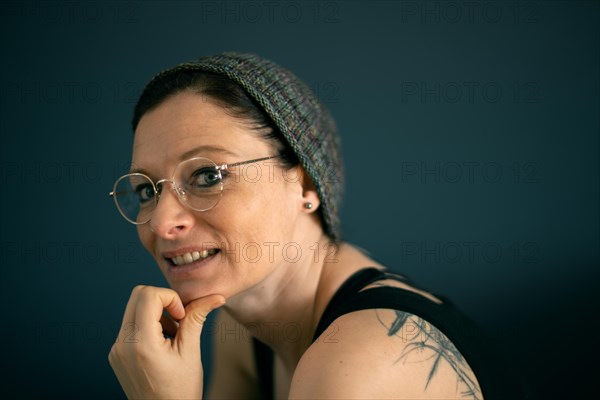 Woman with glasses and knitted cap