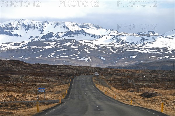 Road near Stykkisholmur in the north of the Snaefellsnes peninsula with view of snow-capped mountains