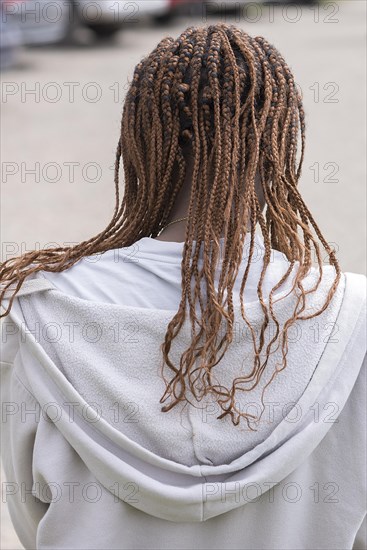 Woman with braided pigtails